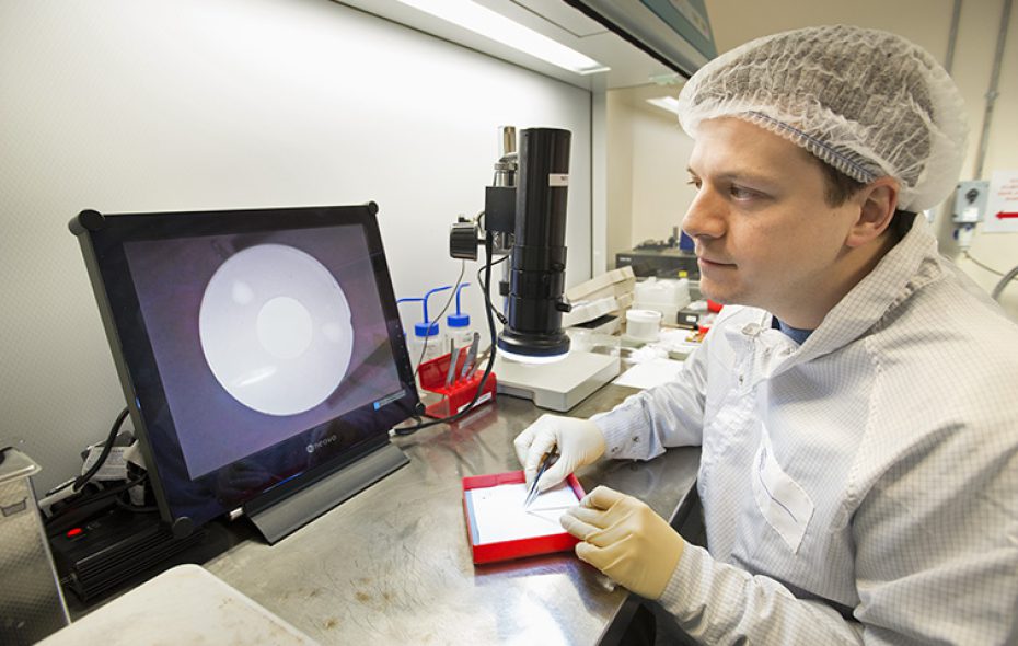 Craig Parsons inspecting a sapphire pill in OXSENSIS' pilot line 1 laboratory at STFC's Rutherford Appleton Laboratory, 4th March 2014