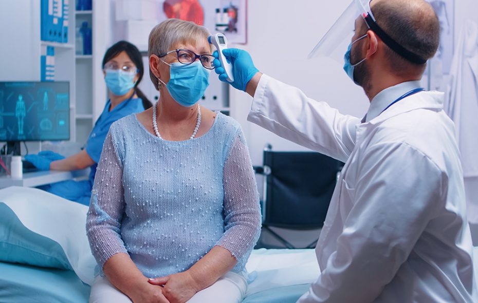 Patient having temperature taken.